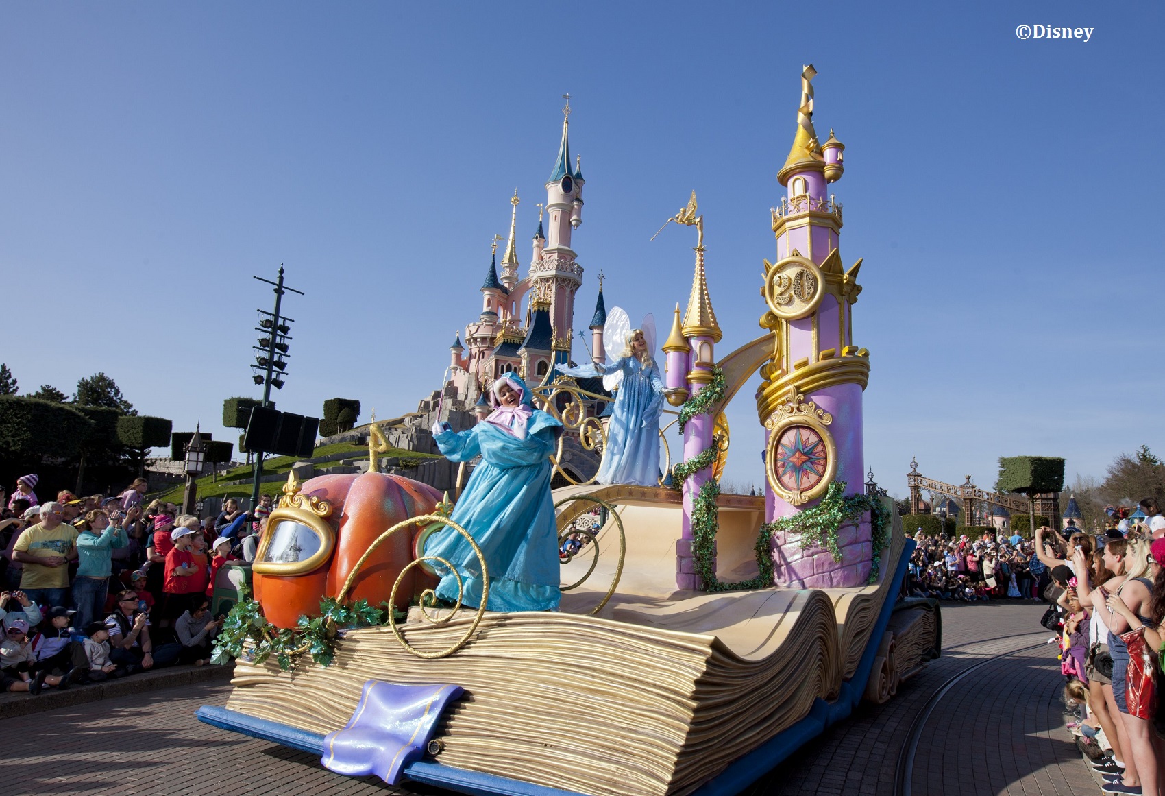 people enjoying, Disneyland parad near a disney castle.