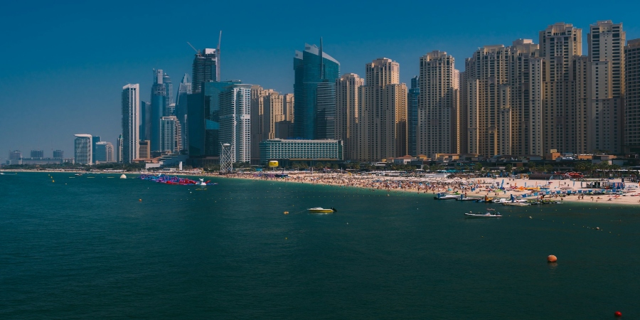 Dubai Beach: Pristine shores bordered by azure waters, offering relaxation and recreation amidst the city's vibrant atmosphere. 