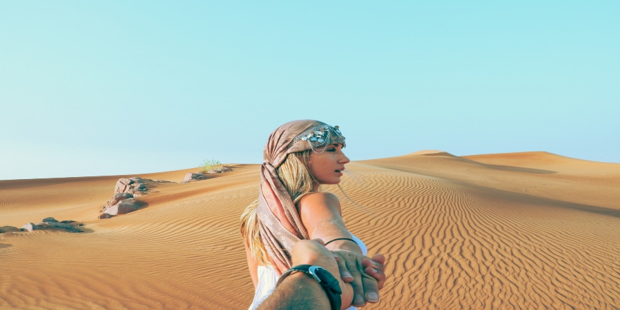 Desert Safari: A thrilling adventure through golden dunes, offering a glimpse into the vast and captivating beauty of the Arabian desert.