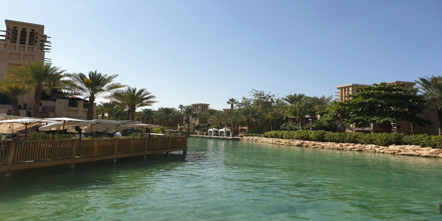 A charming view of Madinat Jumeirah, with its picturesque waterways, traditional architecture, and lush surroundings creating a serene atmosphere.