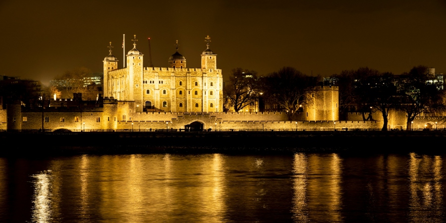 See the Tower of London beautifully illuminated at night—its historic walls glowing in a stunning display, accessible with London hop-on hop-off tours.