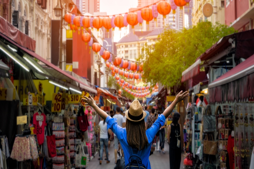 Young woman traveler standing