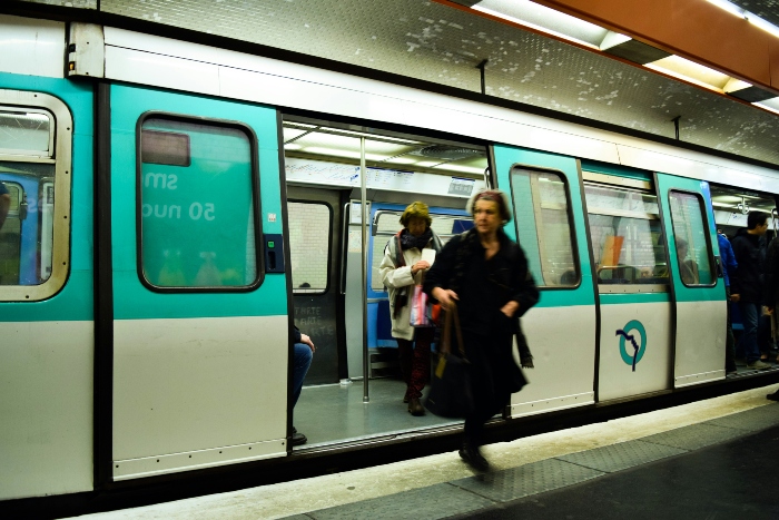 An image of Paris metro and one of its passenger.