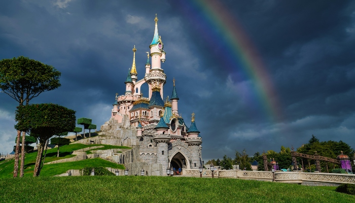 Disneyland Paris with a rainbow in the sky.