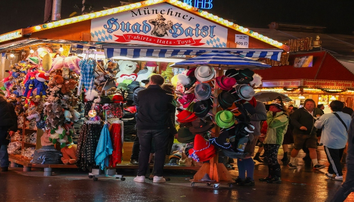 People standing in front of a stall at Oktoberfest