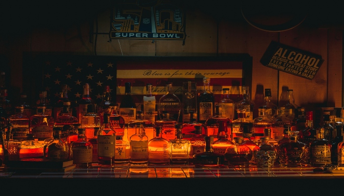 An illuminated whiskey bar.