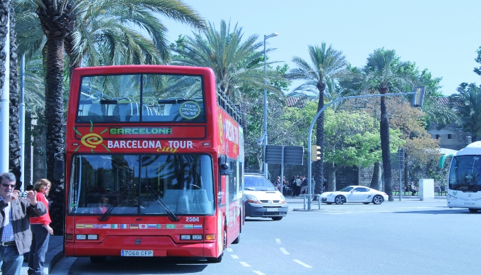 A hop-on hop-off bus in Barcelona ready to take tourists to visit places.