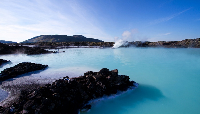 Taking a geothermal bath in Blue Lagoon in Iceland is one of the best things to do.