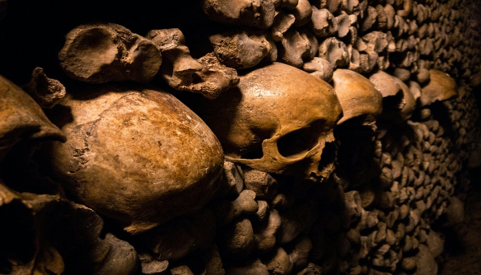A glimpse of catacombs in Paris, a spooky place to visit during Halloween.