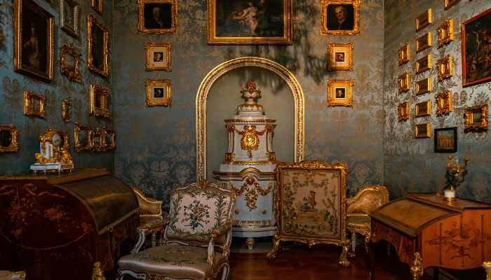 Ornate blue-and-gold royal room with historic paintings, representing Munich’s cultural richness in one day.