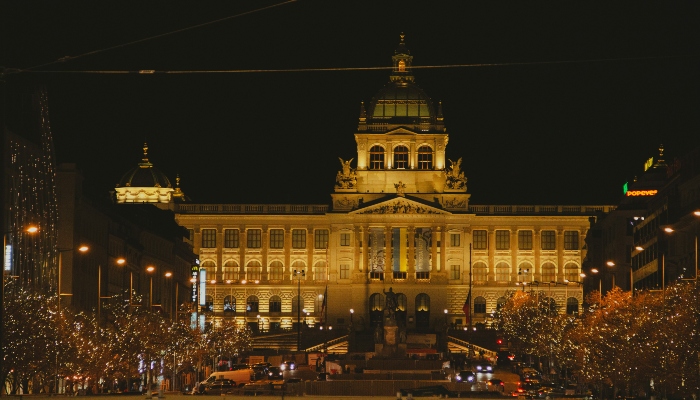 Prague’s National Museum bathed in golden light and surrounded by Christmas markets, a must-see sight within top christmas holiday destinations europe.