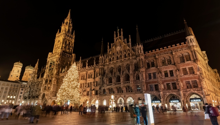 Majestic town hall and illuminated Christmas tree in Munich’s Marienplatz at the best Christmas markets in Europe.