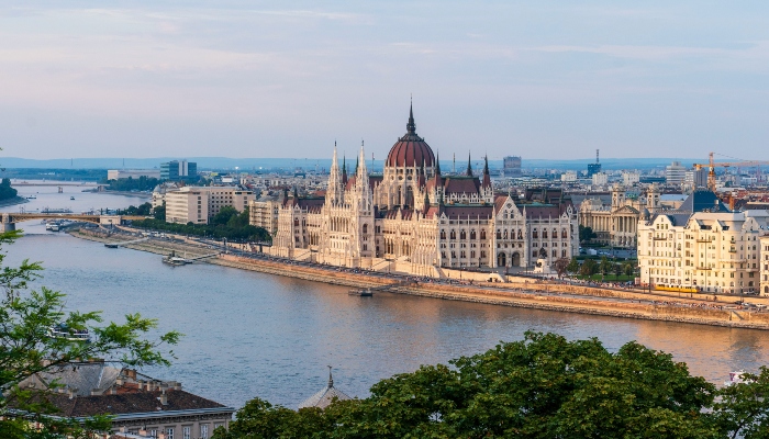 Hungarian Parliament building on the Danube River, illustrating is hop-on hop-off worth it Budapest sightseeing