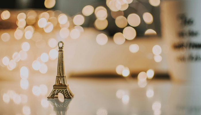Miniature Eiffel Tower figurine with soft golden lights, symbolising love and Valentine’s Day in Paris charm.