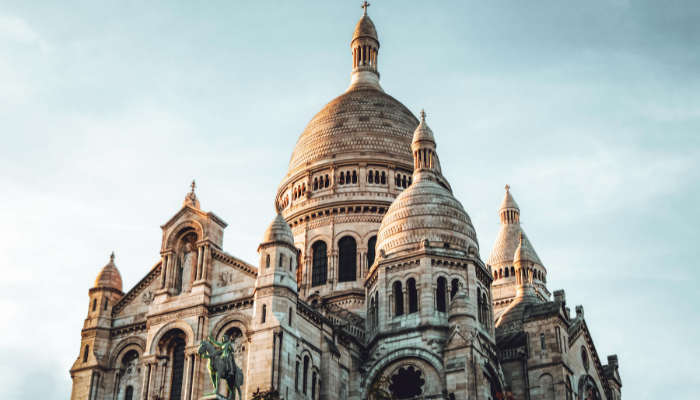 Close-up view of Sacré-Cœur Basilica under a clear sky, one of the most romantic places in Paris for couples.