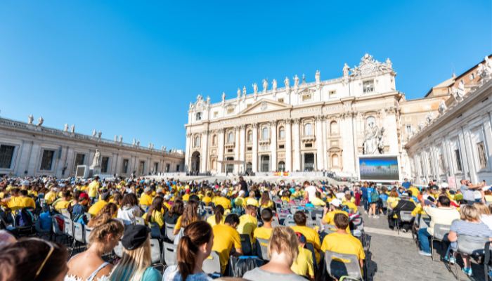 Large crowd gathered in St. Peter’s Square facing St. Peter’s Basilica during a public Papal event in Vatican City in the eve of Easter.