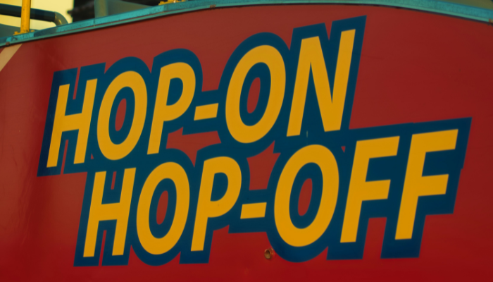 A cut from the bus where hop-on hop-off is written in bold to help people to choose the bus over public transports.