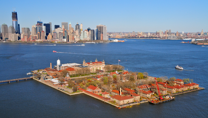 Ellis Island and Statue of Liberty harbor area near Battery Park stop on NYC hop-on hop-off bus route.