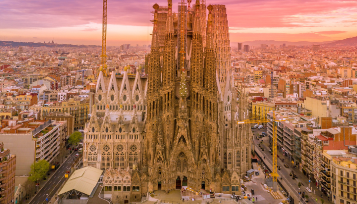 Aerial view of Sagrada Familia in Barcelona at sunset, one of the top spring break destinations in Europe.