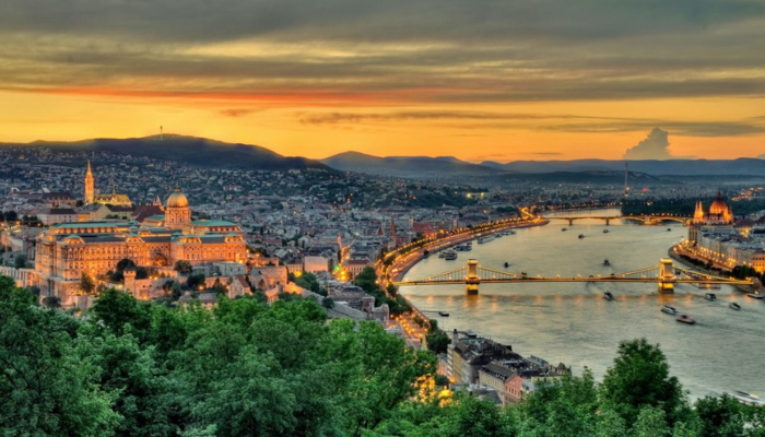 Panoramic view of Budapest city and the Danube River at sunset.
