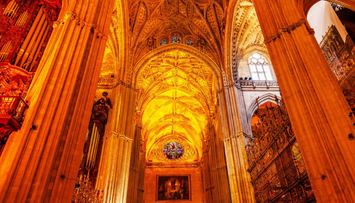 Interior of Seville Cathedral landmark visited on hop-on hop-off sightseeing tours.