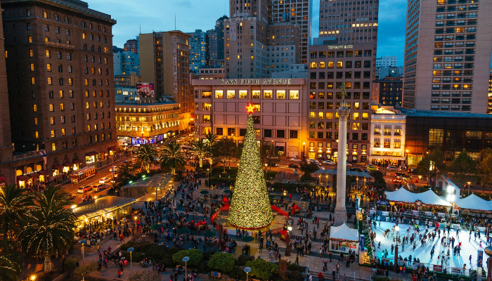 Union Square San Francisco decorated with Christmas tree and ice skating rink during holiday season.