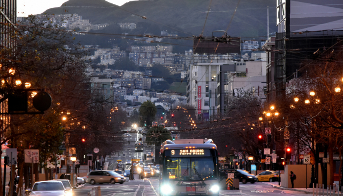 Castro District's street scene with a tram moving through the Castro area, one of America’s most famous LGBTQ neighborhoods.