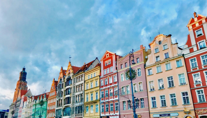 Colorful buildings in Wroclaw old town square with European architecture and vibrant facades.