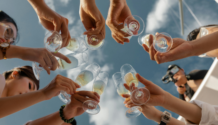 Passengers raising champagne glasses aboard a Chicago cruise, highlighting the social and celebratory experience of dining and sightseeing on the water.