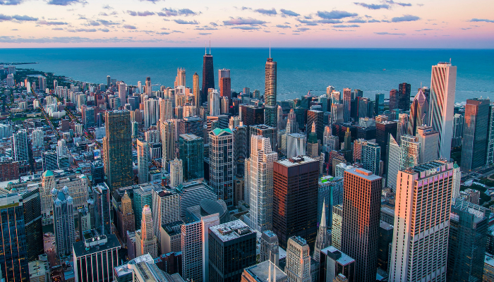 Aerial view of downtown Chicago's skyline along Lake Michigan, showcasing the landmarks and architecture often seen on Chicago boat tours and river cruises.