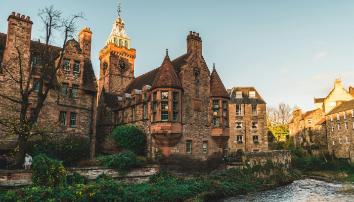 Historic stone houses along the Water of Leith in Dean Village, one of the most picturesque places to visit during 3 days in Edinburgh.