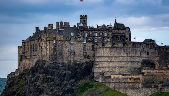Edinburgh Castle standing atop Castle Rock, a must-visit attraction in any Edinburgh itinerary for 3 days.