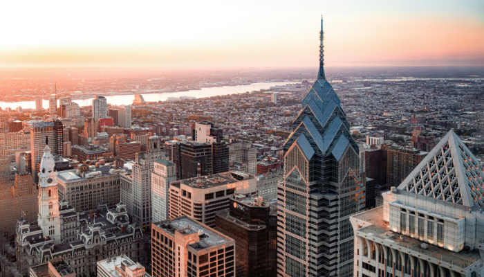 Philadelphia skyline at golden hour featuring city buildings and skyline views from above.