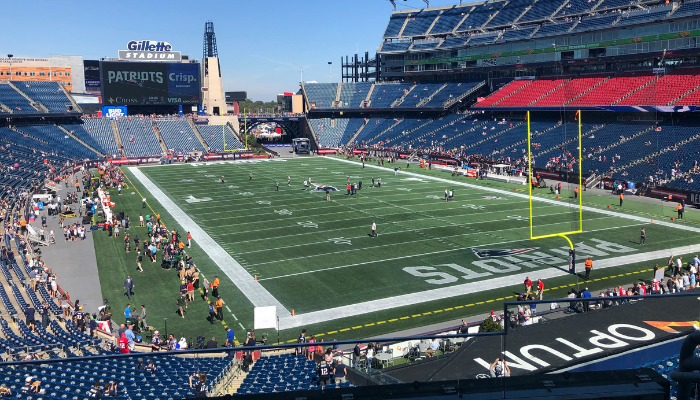 Wide interior view of Gillette Stadium in Boston prepared for a sports event with visitors inside