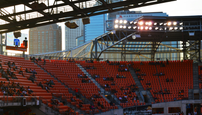 Stadium seating area with fans gathering before a live sports event in a city stadium