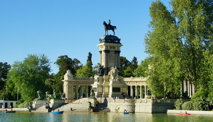 Monument to Alfonso XII overlooking the lake in Retiro Park Madrid.