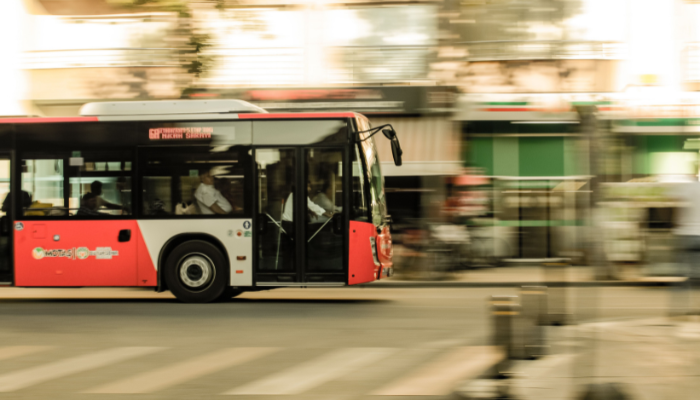 City sightseeing bus travelling through the streets of Athens, offering a convenient way to explore the city's major attractions.