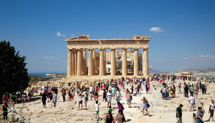 Visitors exploring the Parthenon at the Acropolis, the most iconic stop on Athens hop-on hop-off bus tours.