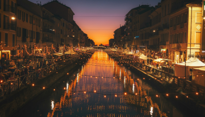 Evening view of the Navigli canals in Milan, a popular district explored on Milan hop-on hop-off bus tours.