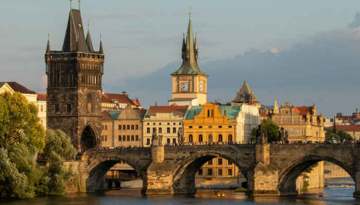 Charles Bridge and Old Town skyline in Prague, a popular and affordable city for solo travel in Europe.