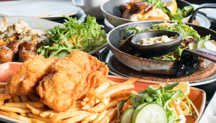 Icelandic meal featuring fried fish, chips, salad and other local dishes