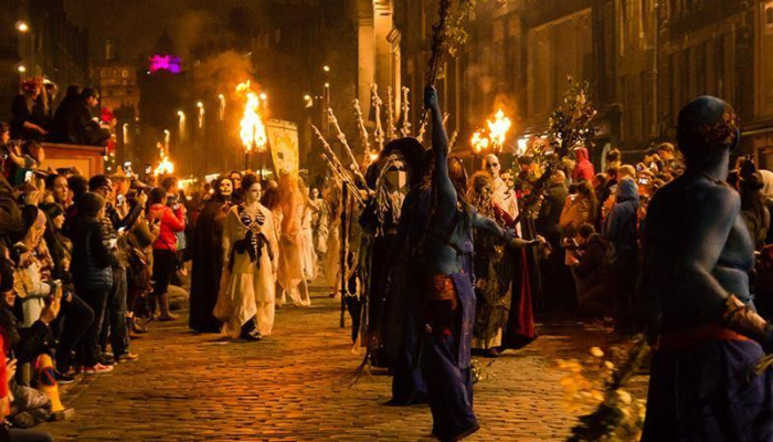 Edinburgh Halloween fire festival with costumed performers and flaming torches in the historic Old Town