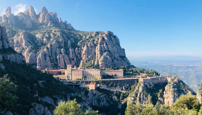 Montserrat mountain range and monastery near Barcelona under a clear blue sky