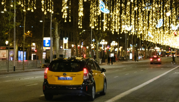 Barcelona street decorated with festive Christmas lights at night