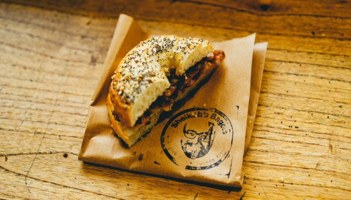 Bagel sandwich served on a wooden table in Buenos Aires