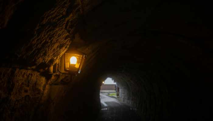 Dark underground tunnel with an old lantern in Edinburgh