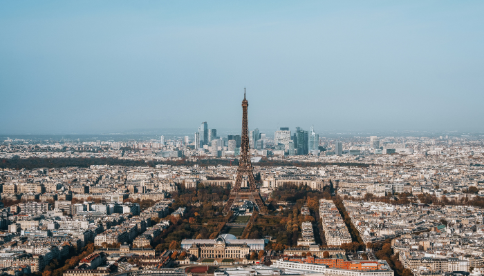 Aerial view of Paris with the Eiffel Tower rising above the city skyline