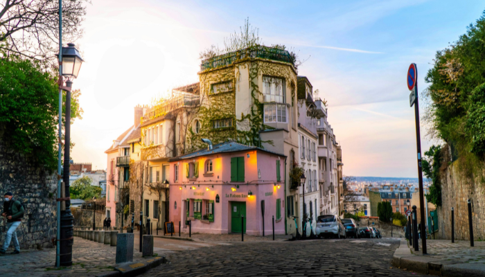 La Maison Rose pink café on a cobbled street in Montmartre, Paris